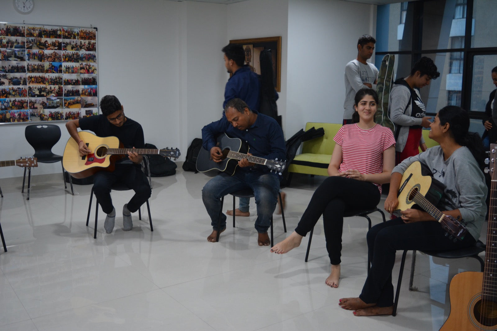 Students playing guitar in class